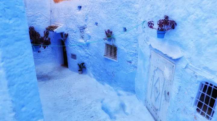 Blue-painted street architecture in Chefchaouen.